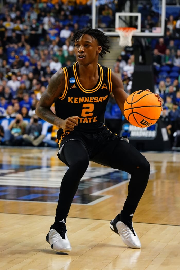 Kennesaw State Owls guard Simeon Cottle (2) dribbles the ball during the first half against the Xavier Musketeers at Greensboro Coliseum in the 2023 NCAA Tournament.